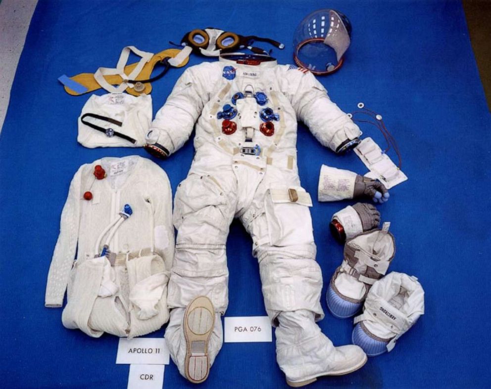 PHOTO: This pre-flight photo shows Neil's suit in its lunar surface configuration, which includes the Liquid Cooled Garment at the left and the EVA (Extra-vehicular) gloves and moon boots at the right.