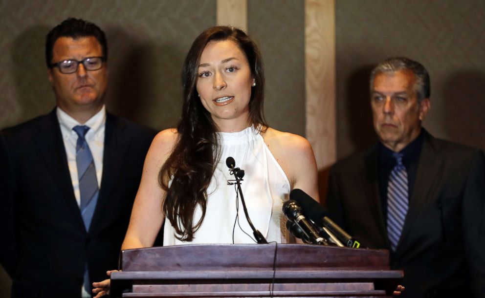 PHOTO: With members of her legal team behind her, Olympic swimmer Ariana Kukors Smith, center, talks to reporters, May 21, 2018, during a news conference in Seattle.