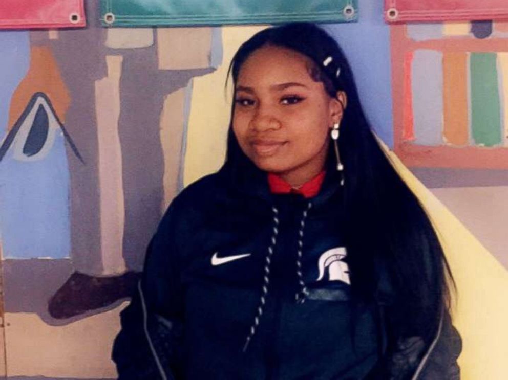 PHOTO: High School senior Arieyanna Williams stands in front a Michigan State flag as the college shes committed to in a hall at her elementary school in Chicago, Illinois.