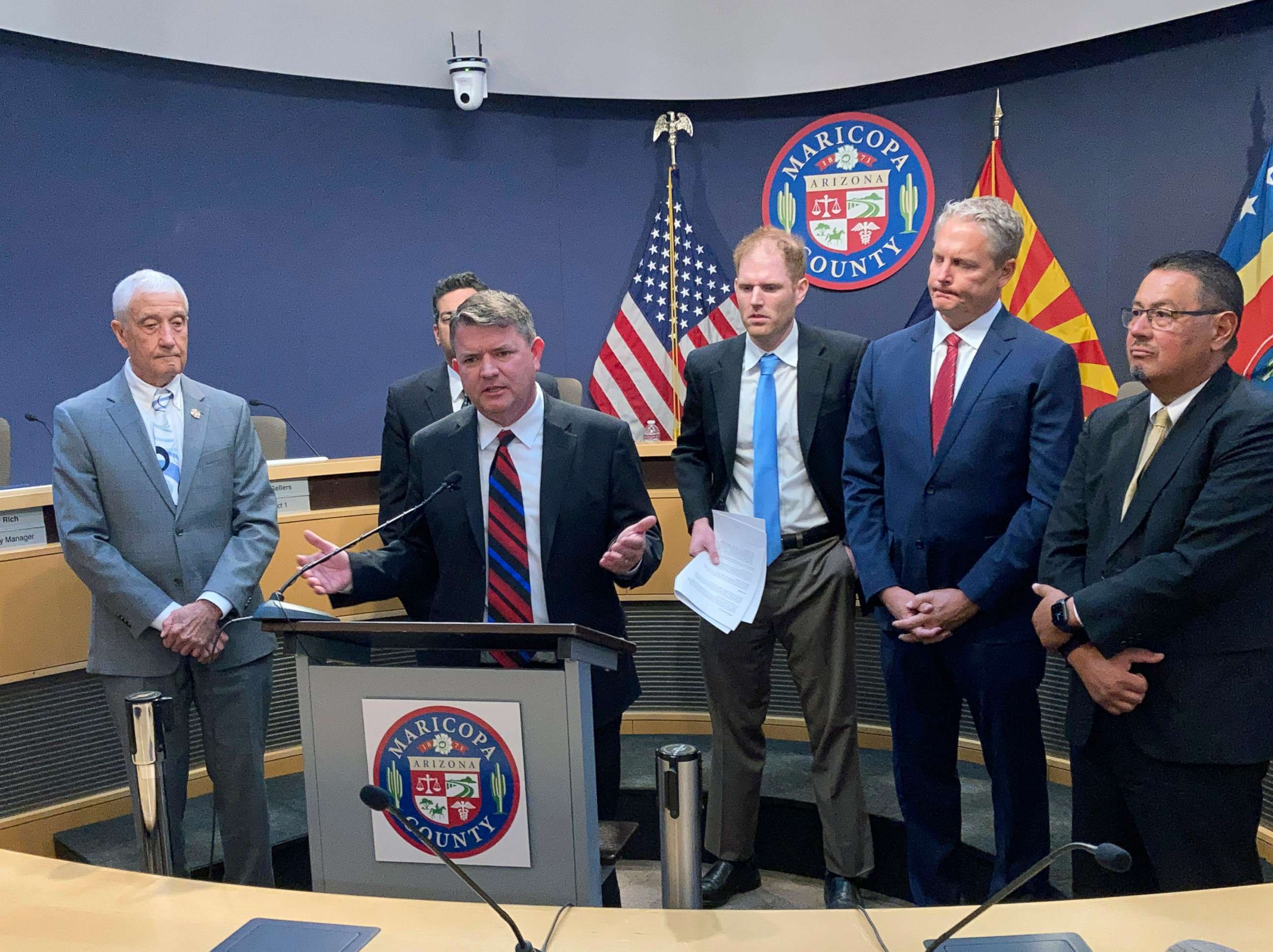 PHOTO: Maricopa County Board of Supervisors Chairman Bill Gates, speaks to reporters while other members of the Board and county Recorder Stephen Richer, third from right, listen, May 4, 2022 in Phoenix.