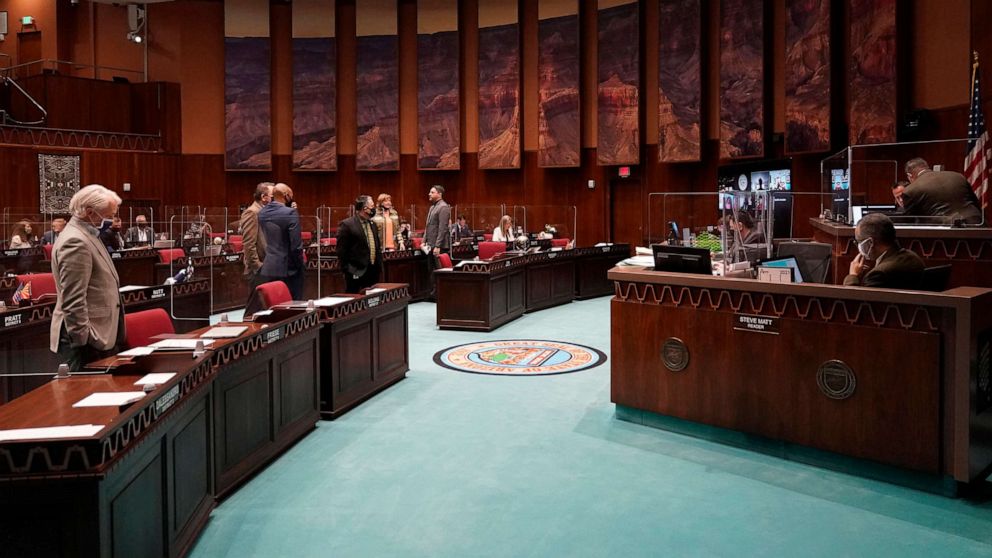 PHOTO: State representatives gather at the Capitol, in Phoenix, Feb. 18, 2021. 