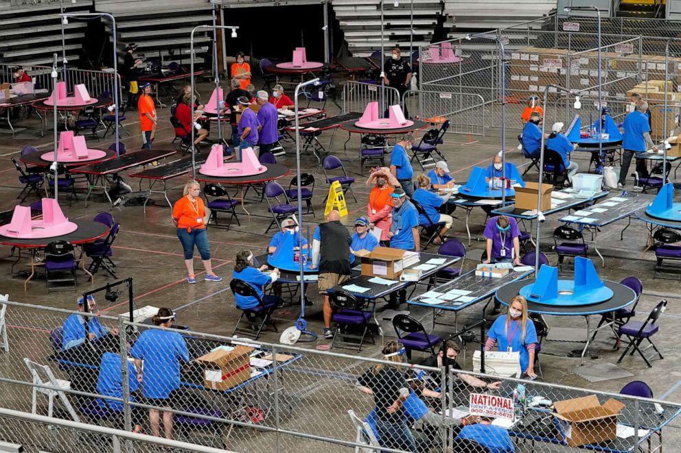 PHOTO: Maricopa County ballots cast in the 2020 general election are examined and recounted by contractors working for Florida-based company, Cyber Ninjas at Veterans Memorial Coliseum in Phoenix, May 6, 2021.