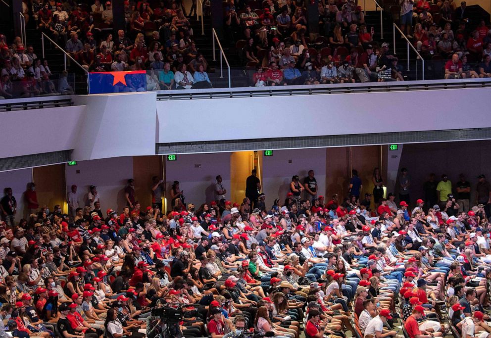 PHOTO: Supporters listen as President Donald Trump speaks during a Students for Trump event at the Dream City Church in Phoenix, Arizona, June 23, 2020.