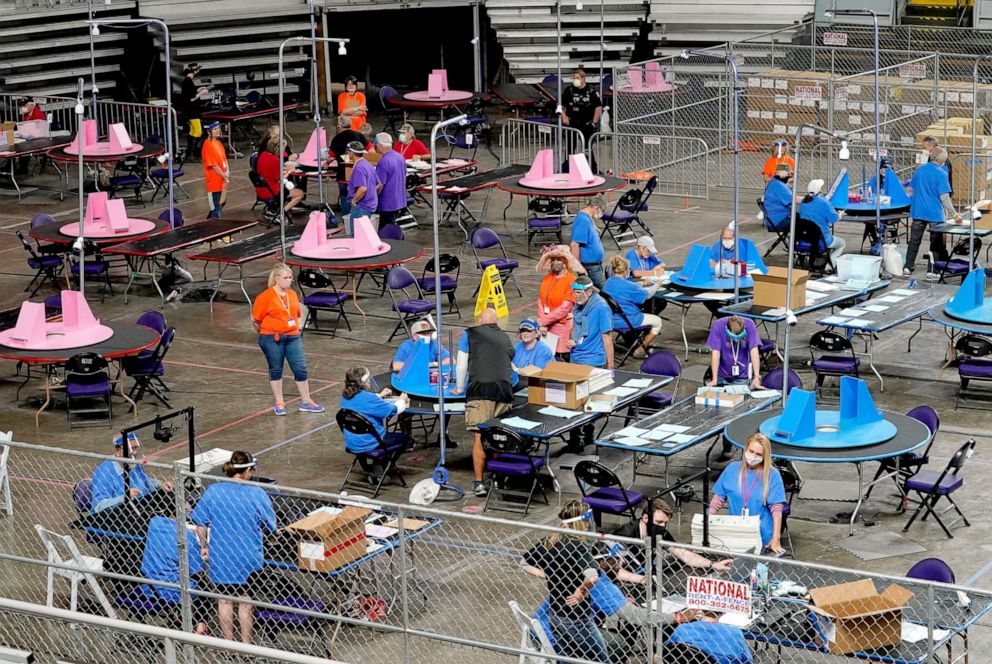 PHOTO: Maricopa County ballots cast in the 2020 general election are examined and recounted by contractors working for Florida-based company, Cyber Ninjas, at Veterans Memorial Coliseum in Phoenix, May 6, 2021.