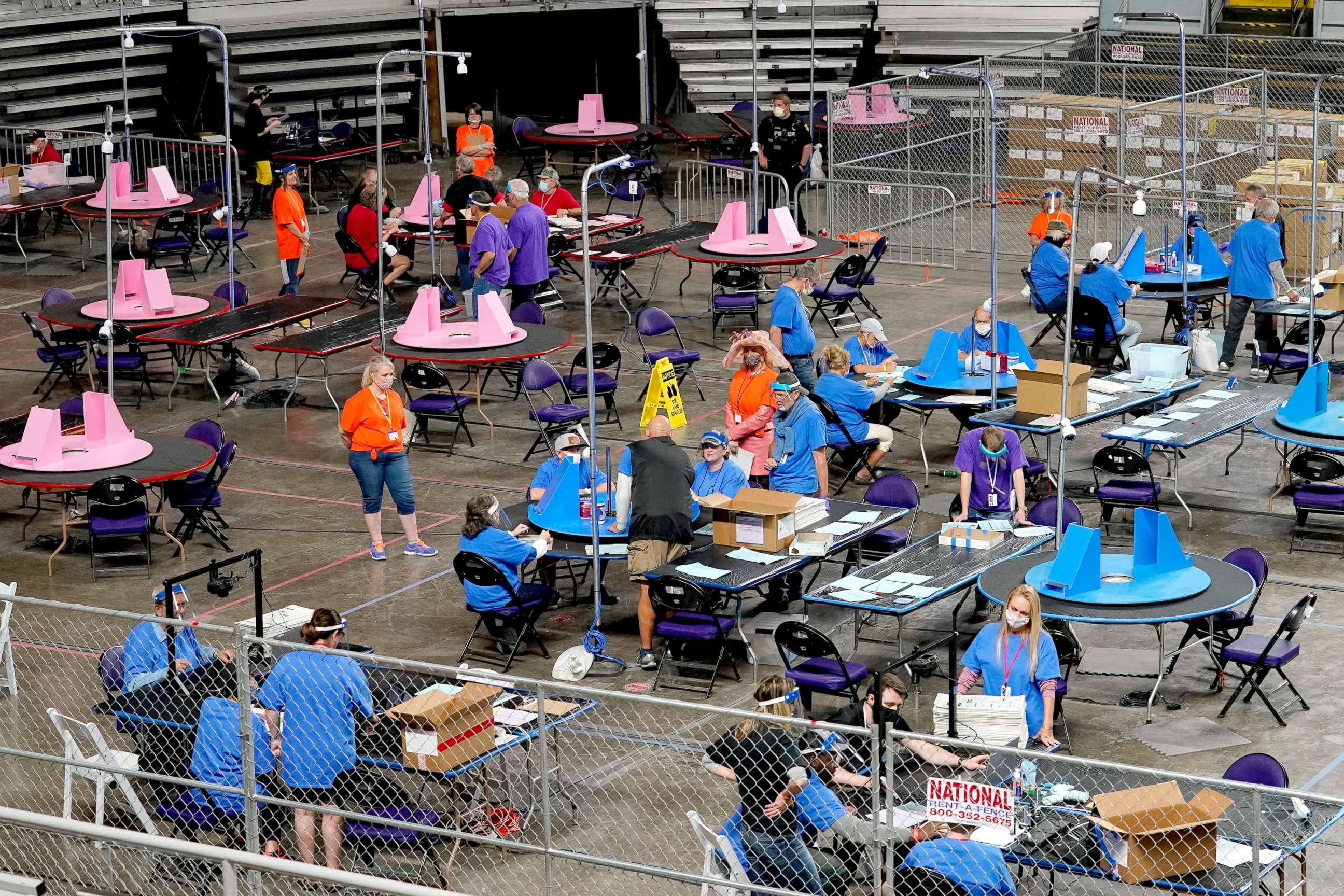 PHOTO: In this May 6, 2021, file photo, Maricopa County ballots cast in the 2020 general election are examined and recounted by contractors working for Florida-based company, Cyber Ninjas, at Veterans Memorial Coliseum in Phoenix.