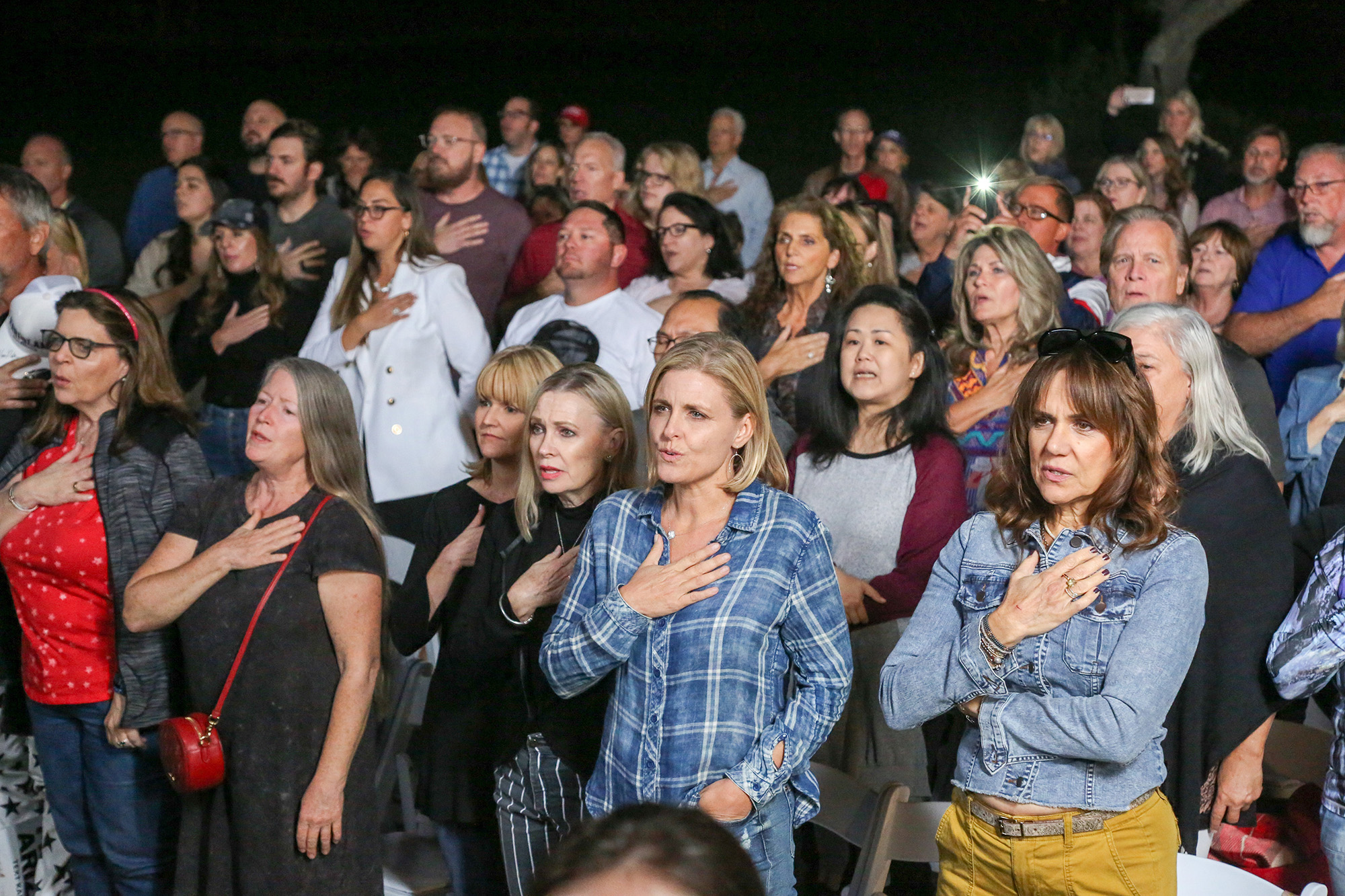 PHOTO: Supporters of Arizona GOP gubernatorial candidate Kari Lake say the pledge of allegiance before hearing her speak at a campaign appearance in Scottsdale, Ariz., Oct. 27, 2022.