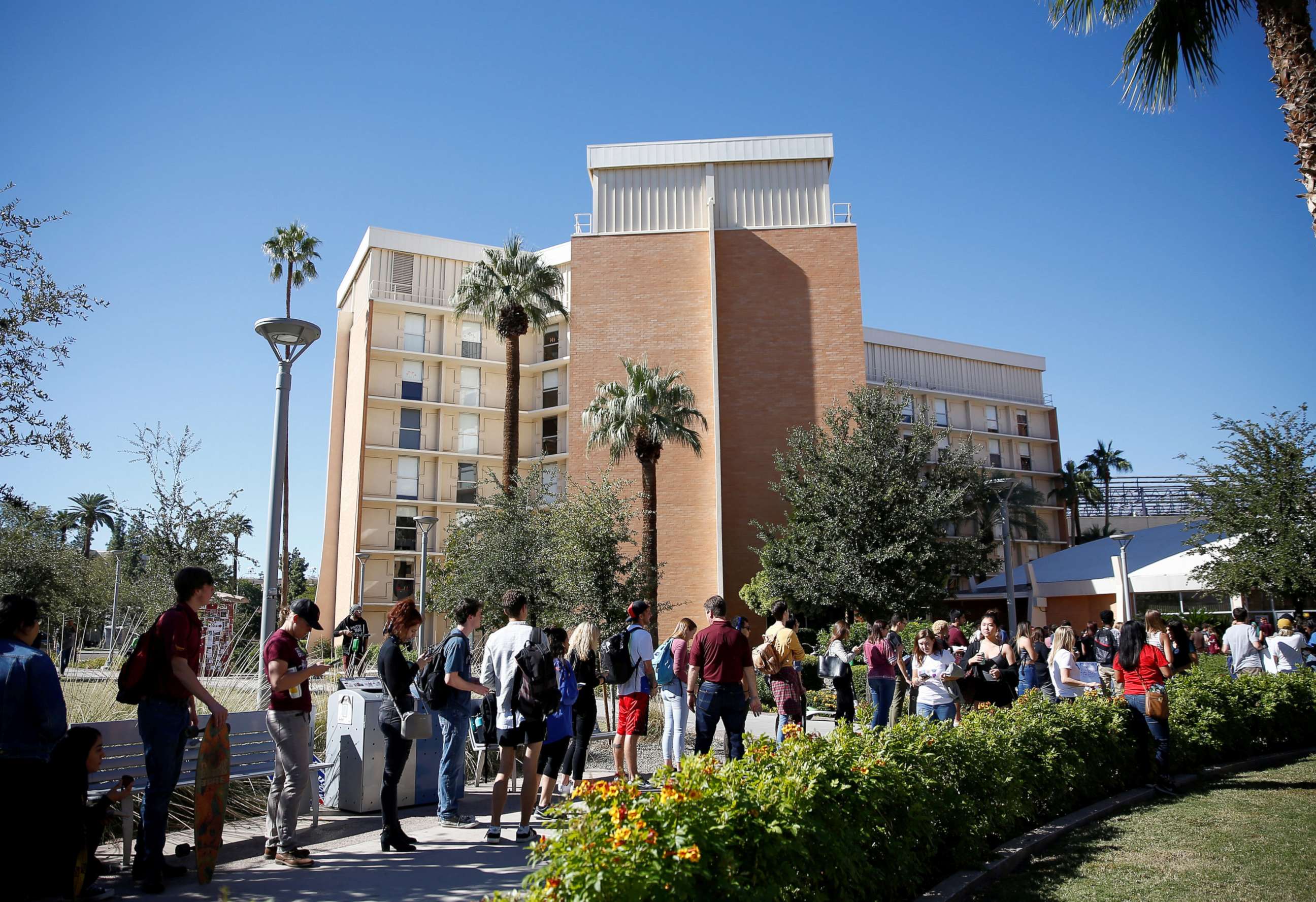 PHOTO: People line up to vote at the ASU Palo Verde West polling station during the U.S. midterm elections in Tempe, Arizona, Nov. 6, 2018.