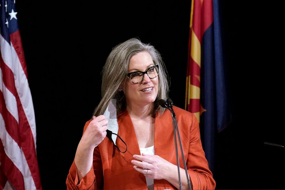 PHOTO: Arizona Secretary of State Katie Hobbs removes her face mask as she addresses the members of Arizona's Electoral College prior to them casting their votes, Dec. 14, 2020, in Phoenix.