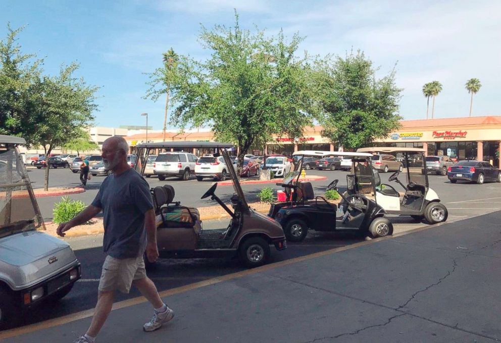 PHOTO: This April 11, 2018 photo shows golf carts at a shopping center in Sun City, Ariz. Republican Debbie Lesko, one of the candidates running for Congress here, is credited with legalizing carts for street use as a state legislator.