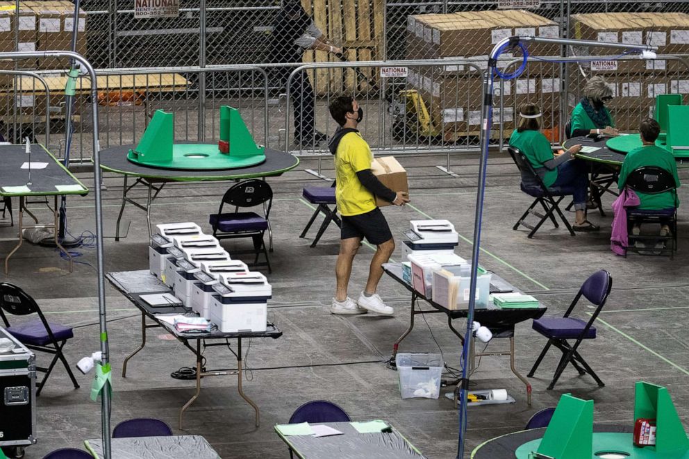 PHOTO: A box of Maricopa County ballots cast in the 2020 general election are delivered to be examined and recounted by contractors hired by the Arizona Senate, June 1, 2021, at the Veterans Memorial Coliseum, in Phoenix.