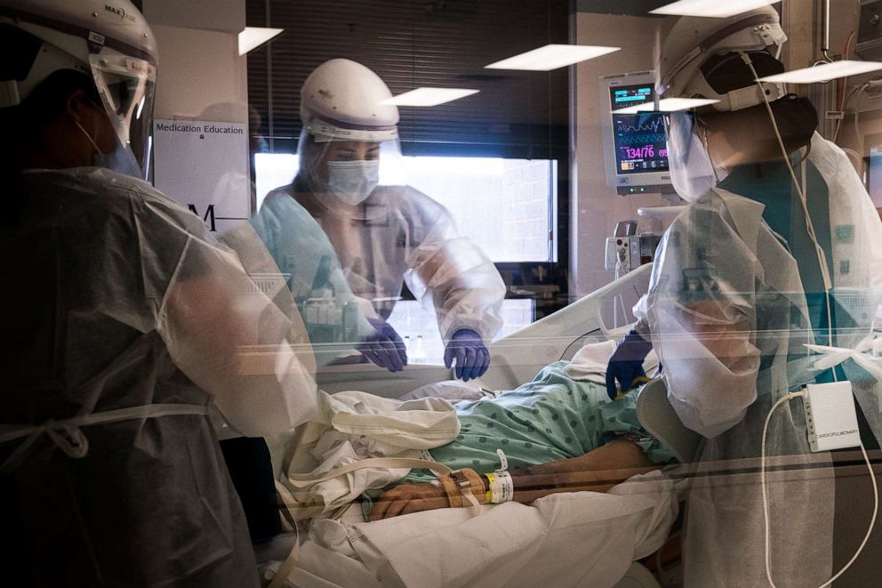 PHOTO: Health care workers help a COVID-19 patient at a hospital in Mountain Home, Ark., July 8, 2021.