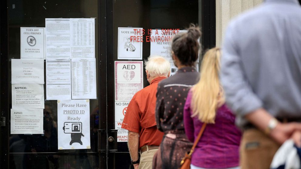 PHOTO: Voters stand in line, Oct. 19, 2020 at the Pulaski County Regional Building in downtown Little Rock, Ark.