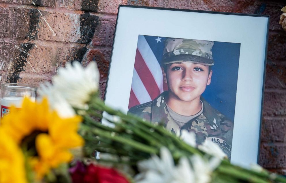 PHOTO:  Flowers are laid next to a portrait at a march and vigil in honor of murdered Army Spec. Vanessa Guillen in Austin, Texas, July 12, 2020.