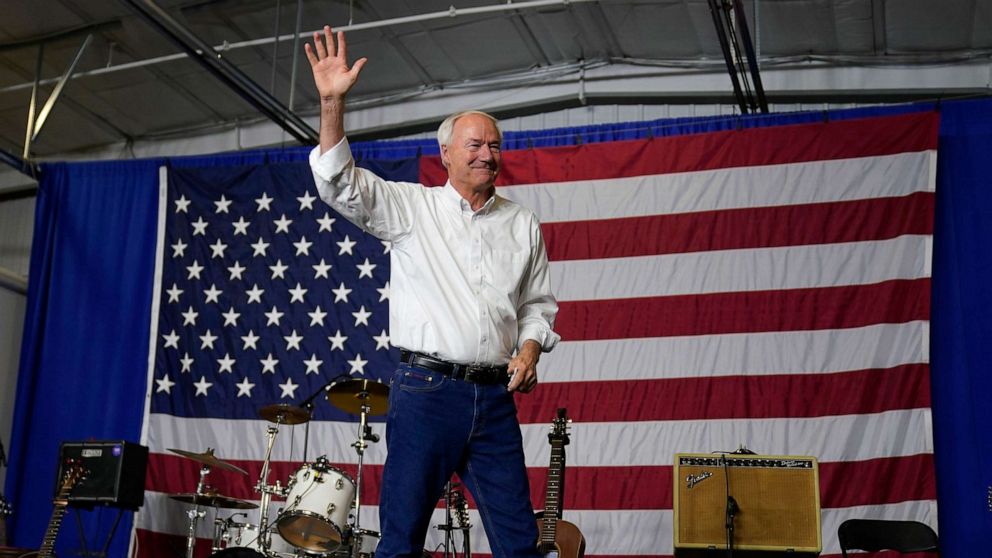 PHOTO: Republican presidential candidate former Arkansas Gov. Asa Hutchinson waves to the audience during an event on Aug. 6, 2023, in Cedar Rapids, Iowa.