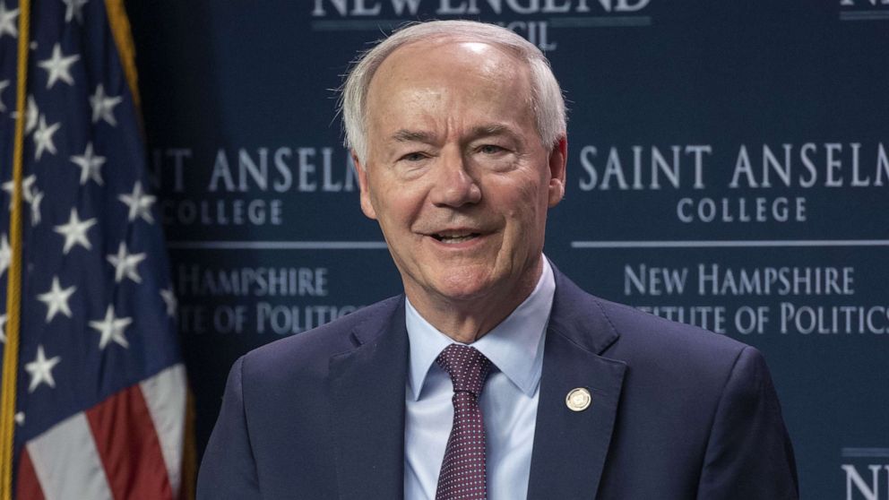 PHOTO: Arkansas Governor Asa Hutchinson addresses an audience during the Politics & Eggs forum held at the New Hampshire Institute of Politics & Political Library at Saint Anselm College, in Manchester, N.H., on April 25, 2022.