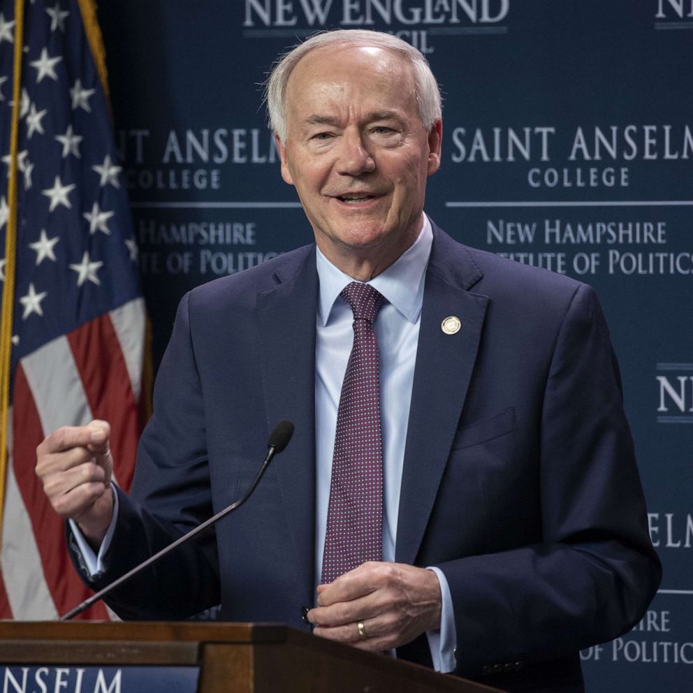 PHOTO: Arkansas Governor Asa Hutchinson addresses an audience during the Politics & Eggs forum held at the New Hampshire Institute of Politics & Political Library at Saint Anselm College, in Manchester, N.H., on April 25, 2022.