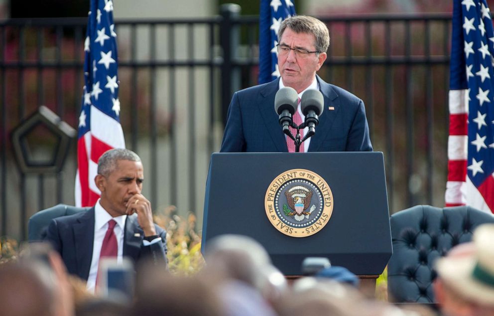 PHOTO: President Barack Obama listens as Secretary of Defense Ash Carter delivers a speech at the Pentagon Memorial September 11, 2016 in Arlington, Virginia.
