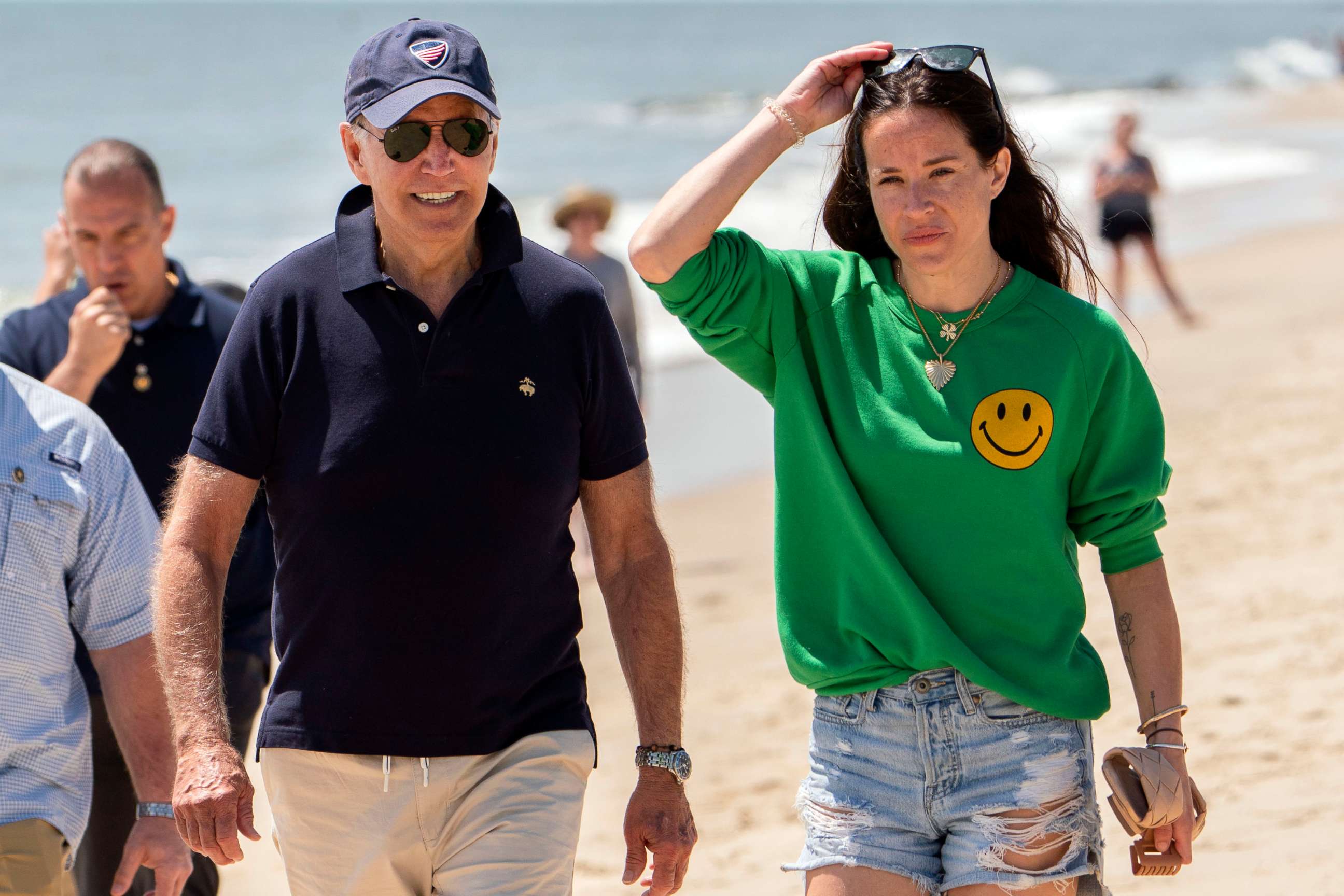 PHOTO: President Joe Biden walks on the beach with daughter Ashley Biden, in Rehoboth Beach, Del., June 20, 2022. 