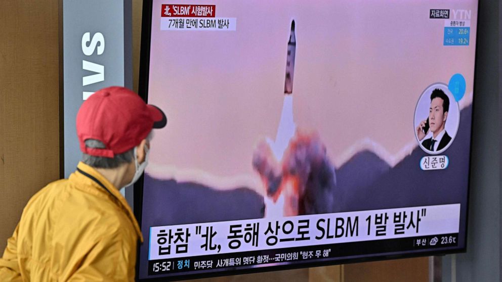 PHOTO: People watch a television screen showing a news broadcast with footage of a North Korean missile test at a railway station after North Korea fired a submarine-launched ballistic missile according to South Korea's military, in Seoul,  May 7, 2022. 