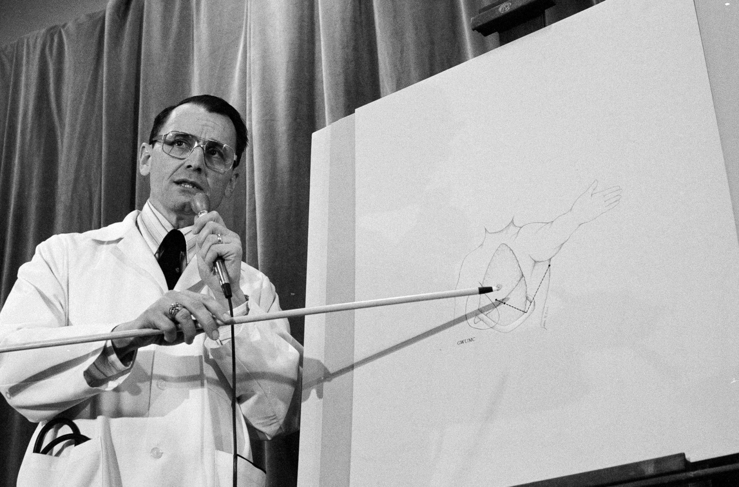PHOTO: Dr. Benjamin Aaron, who performed surgery on President Reagan's gunshot wounds, shows on a chart the trajectory of the bullet that entered Reagan's lung in Washington, March 30, 1981.
