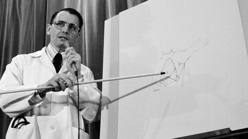 PHOTO: Dr. Benjamin Aaron, who performed surgery on President Reagan's gunshot wounds, shows on a chart the trajectory of the bullet that entered Reagan's lung in Washington, March 30, 1981.