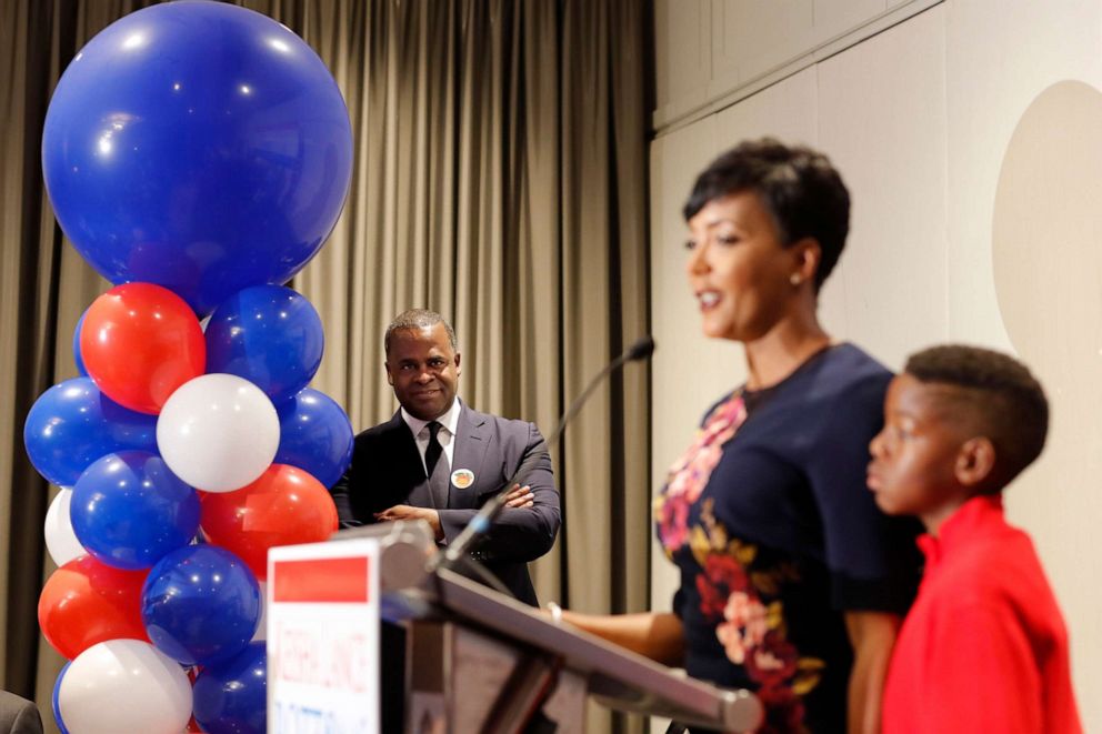 PHOTO: Atlanta Mayor Kasim Reed, left, watches as city councilwoman and mayoral candidate Keisha Lance Bottoms speaks at an election night party in Atlanta, Nov. 8, 2017. 