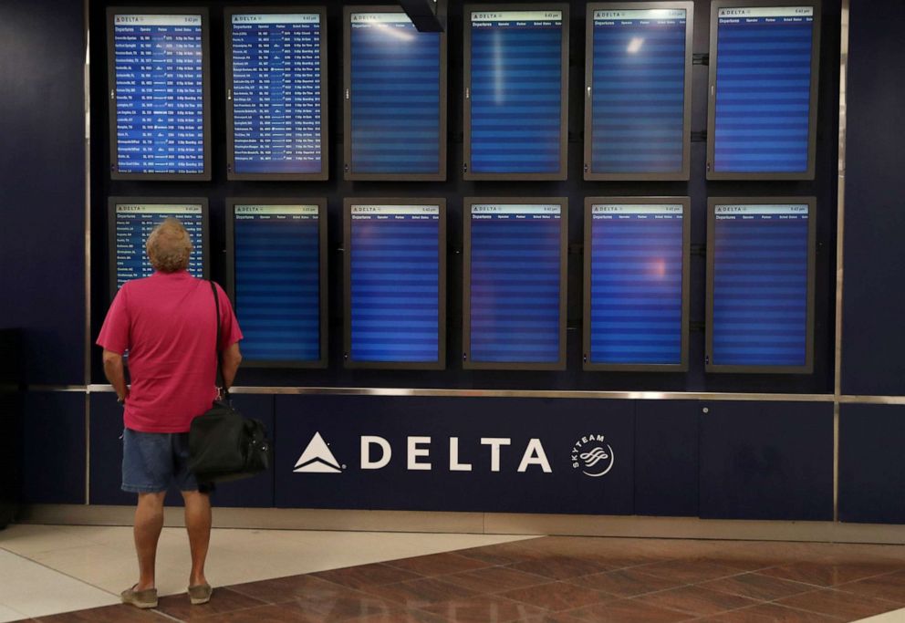 PHOTO: A man looks at mostly empty flight schedule screens in the Atlanta International Airport as the coronavirus outbreak continues in Atlanta, May 29, 2020.