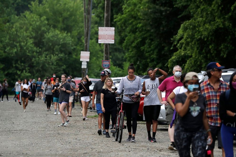 PHOTO: People wait in line to vote in the Georgia's primary election at Park Tavern on Tuesday, June 9, 2020, in Atlanta.