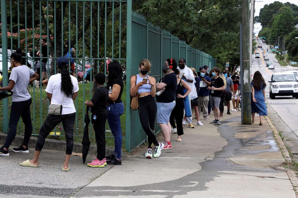 PHOTO: Voters line up outside of a polling location to cast their ballots after Democratic and Republican primaries were delayed due to COVID-19 restrictions in Atlanta, June 9, 2020.