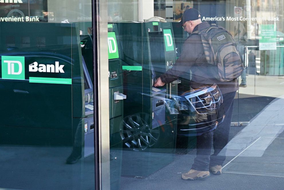 PHOTO: A man uses an ATM  machine at a TD Bank branch in New York, March 22, 2020.