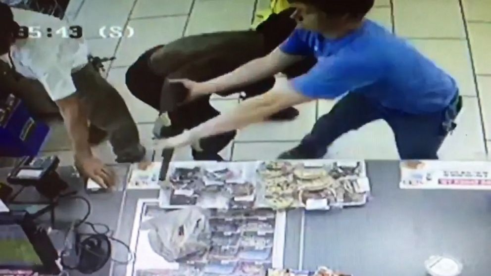 PHOTO: Surveillance footage shows a customer trying wrest control of a gun from a man who attempted to rob a 7-11 store in Prince George's County, Md., Aug. 30, 2019.