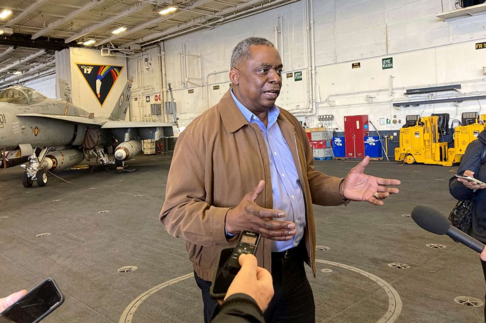 PHOTO: Defense Secretary Lloyd Austin speaks to reporters after arriving on the aircraft carrier USS Nimitz, Thursday, Feb. 25, 2021, at sea.