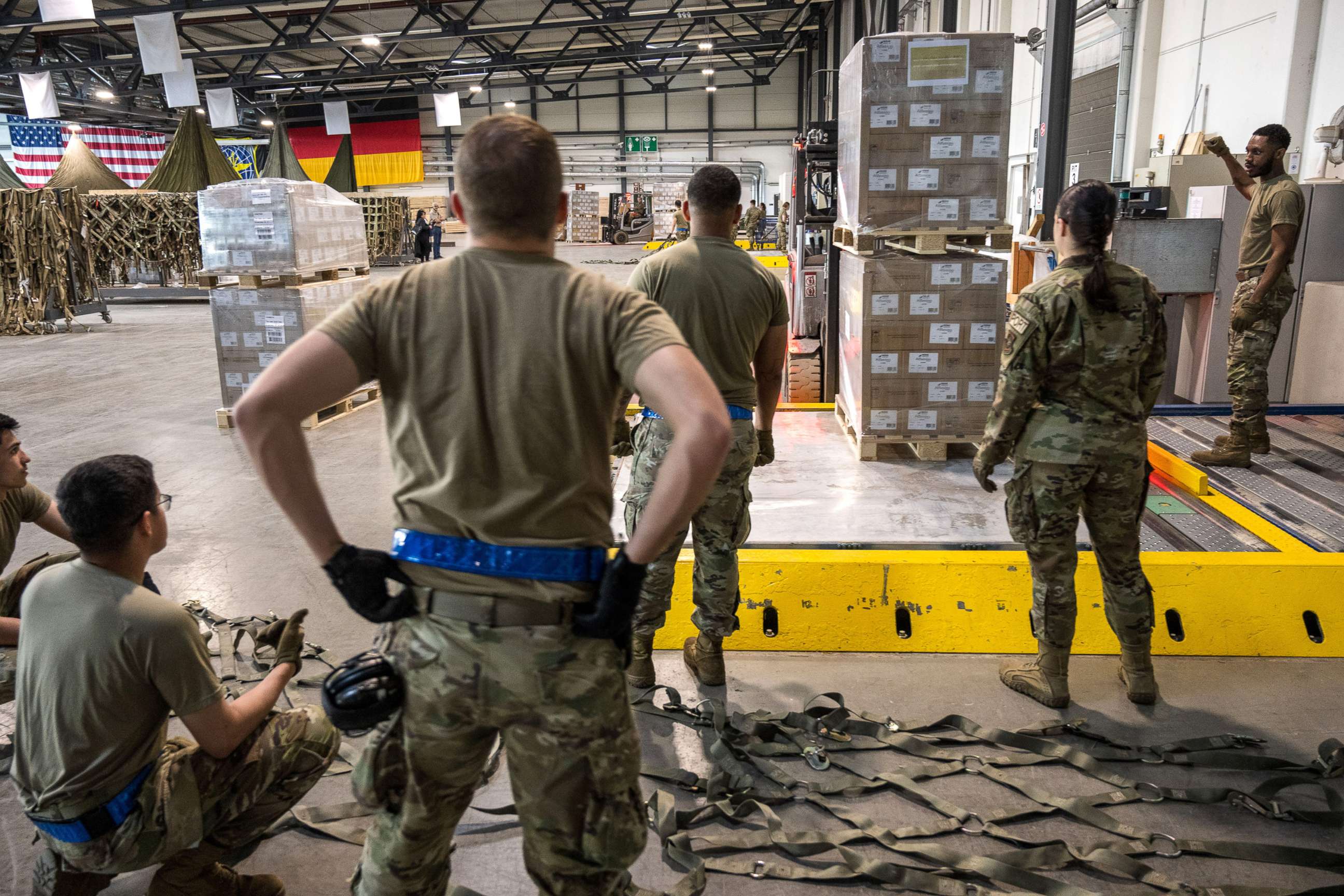 PHOTO: U.S. soldiers load pallets with baby formula which arrived by three trucks from Switzerland, at Ramstein American Air Force base on May 21, 2022 in Ramstein-Miesenbach, Germany.