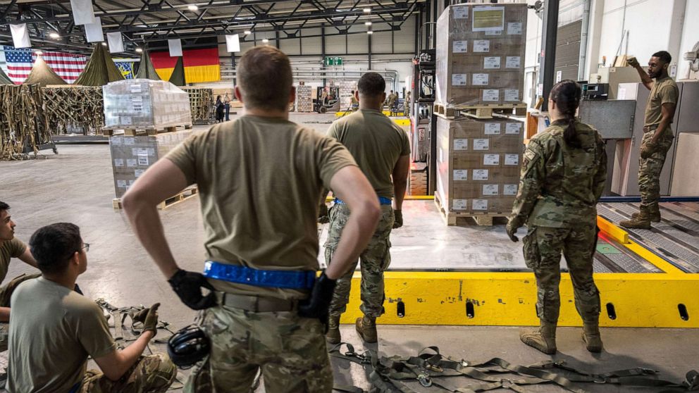 PHOTO: U.S. soldiers load pallets with baby formula which arrived by three trucks from Switzerland, at Ramstein American Air Force base on May 21, 2022 in Ramstein-Miesenbach, Germany.