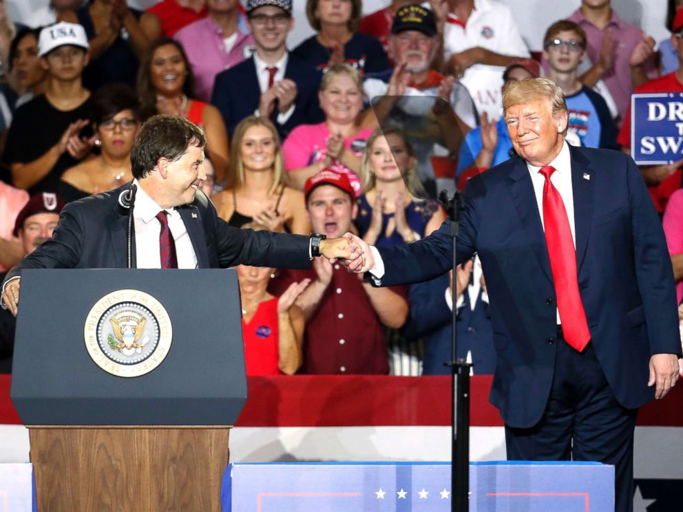 PHOTO: President Donald Trump, right, shakes hands with 12th Congressional District Republican candidate Troy Balderson, during a rally on Aug. 4, 2018, in Lewis Center, Ohio.