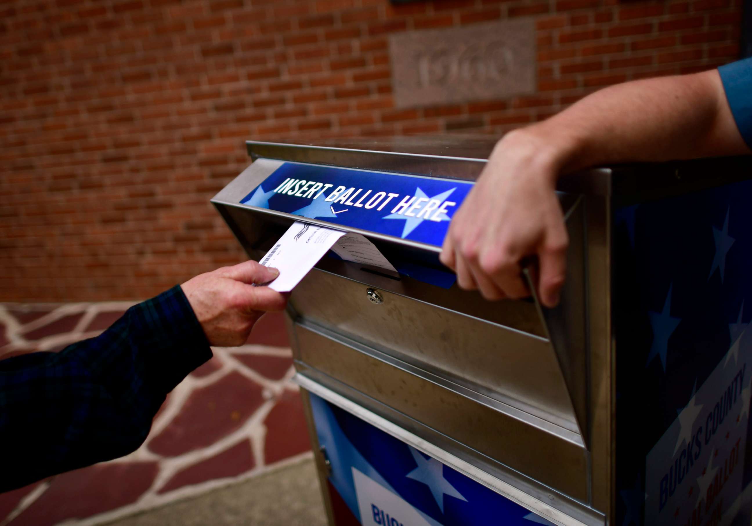 PHOTO: In this June 2, 2020, file photo, a primary voter drops a mail-in ballot into a drop box outside the Bucks County Courthouse in Doylestown, Pa., on June 2, 2020.