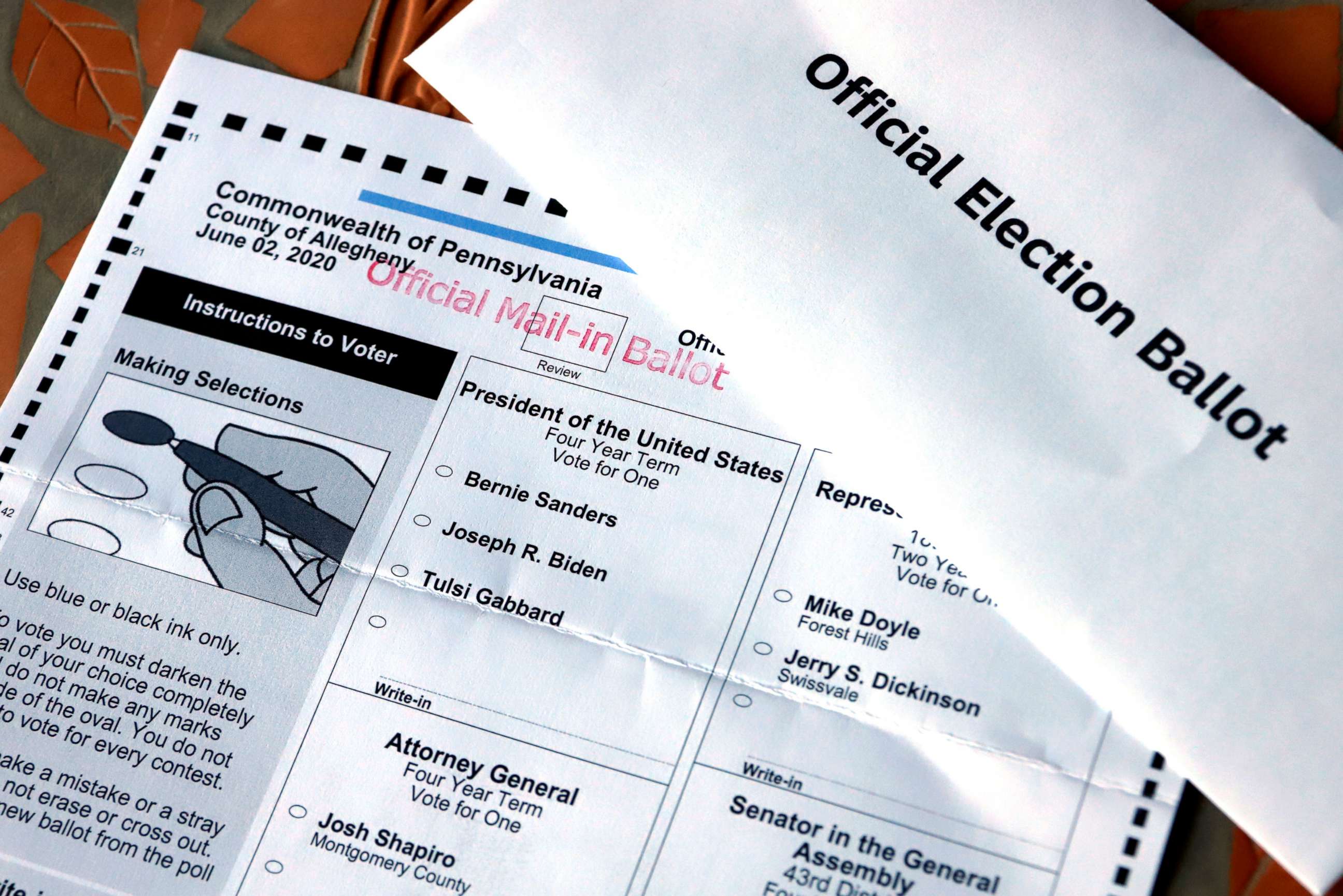 PHOTO: An Official Democratic General Primary mail-in ballot sits with a secrecy envelope, for the Pennsylvania primary in Pittsburgh, May 26, 2020.