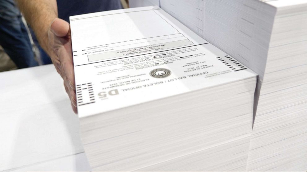 PHOTO: Vote by mail ballots are prepared by Runbeck Election Services.
