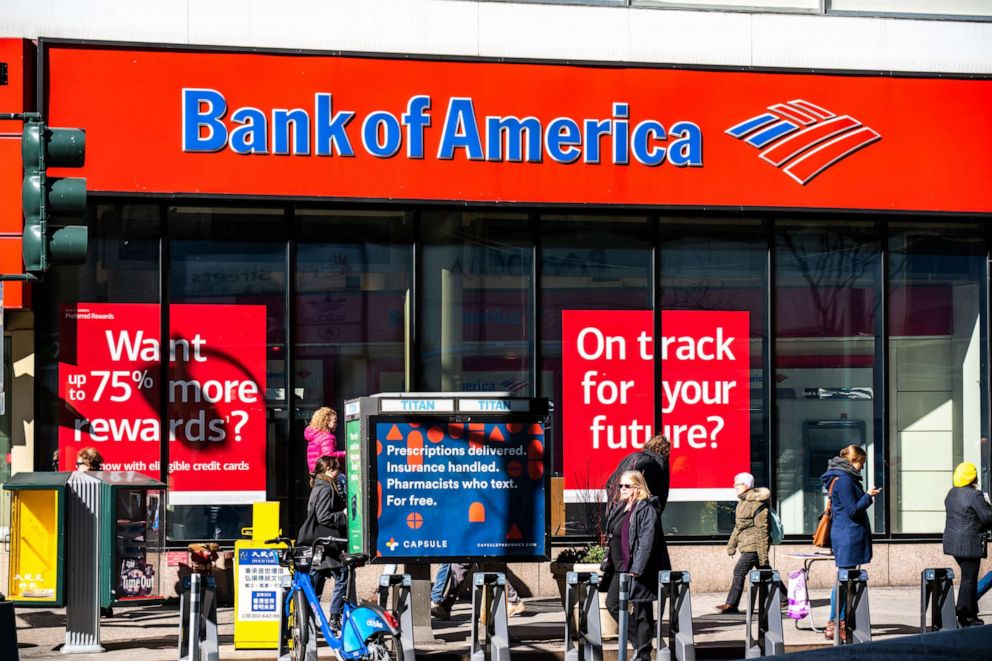 PHOTO: Pedestrians walk past a branch of Bank of America in New York City.