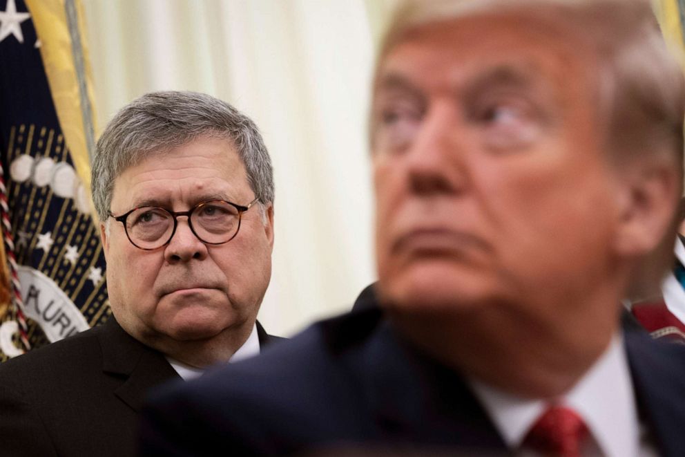 File photo: Attorney General William Barr and President Donald Trump in the Oval Office of the White House on Nov. 26, 2019, in Washington.File-Drew Angerer/Getty Images