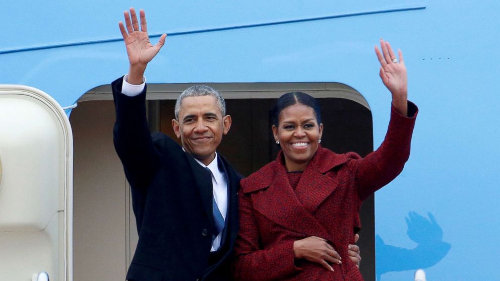 Former President Barack Obama waves with his wife Michelle at Joint Base Andrews, Maryland, Jan. 20, 2017.