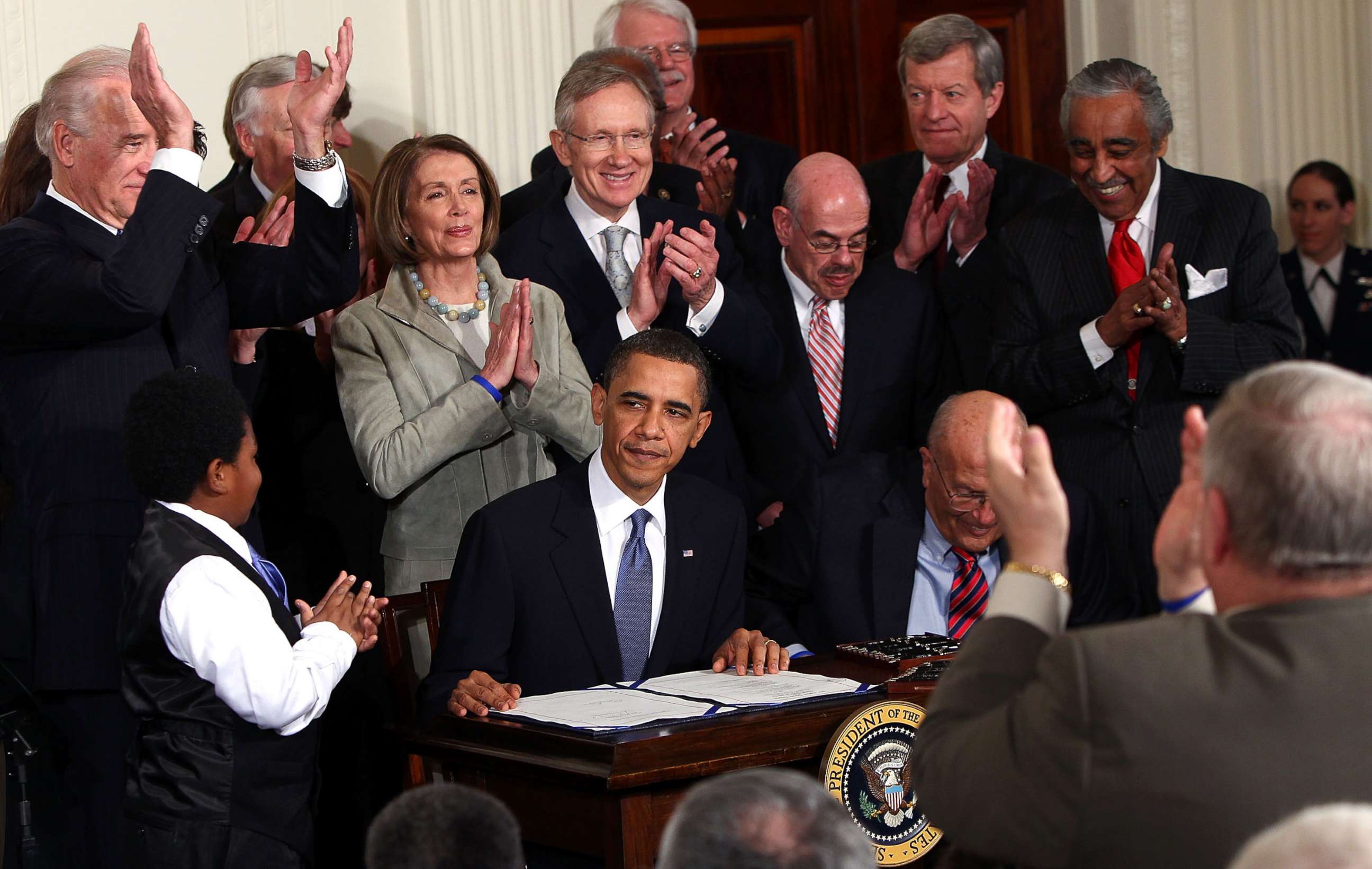 PHOTO: President Barack Obama is applauded after signing the Affordable Health Care for America Act during a ceremony with fellow Democrats in the East Room of the White House, March 23, 2010 in Washington, D.C. 