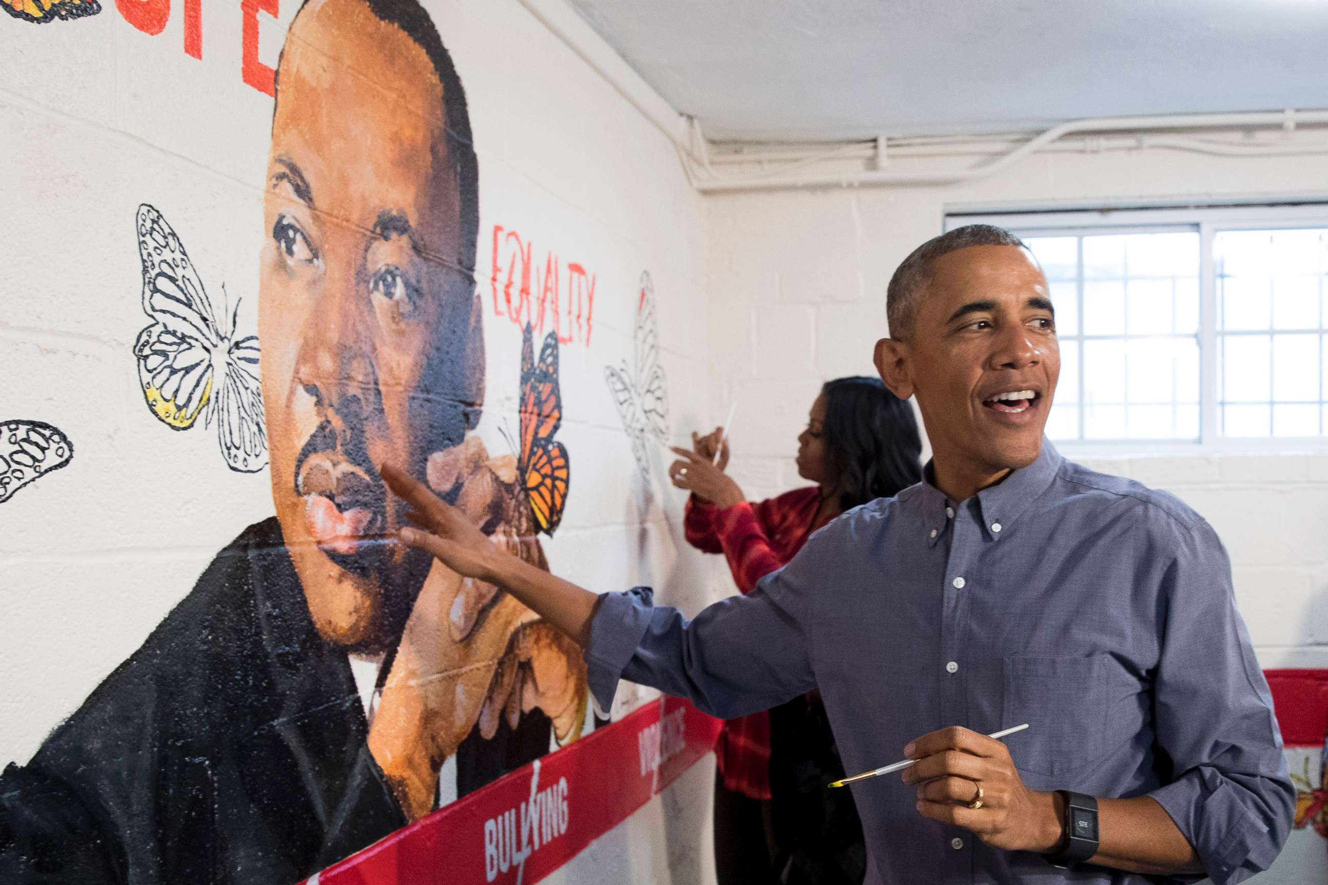 PHOTO: President Barack Obama and first lady Michelle Obama help paint a mural depicting Martin Luther King Jr., at the Jobs Have Priority Naylor Road Family Shelter, Jan. 16, 2017 in Washington.