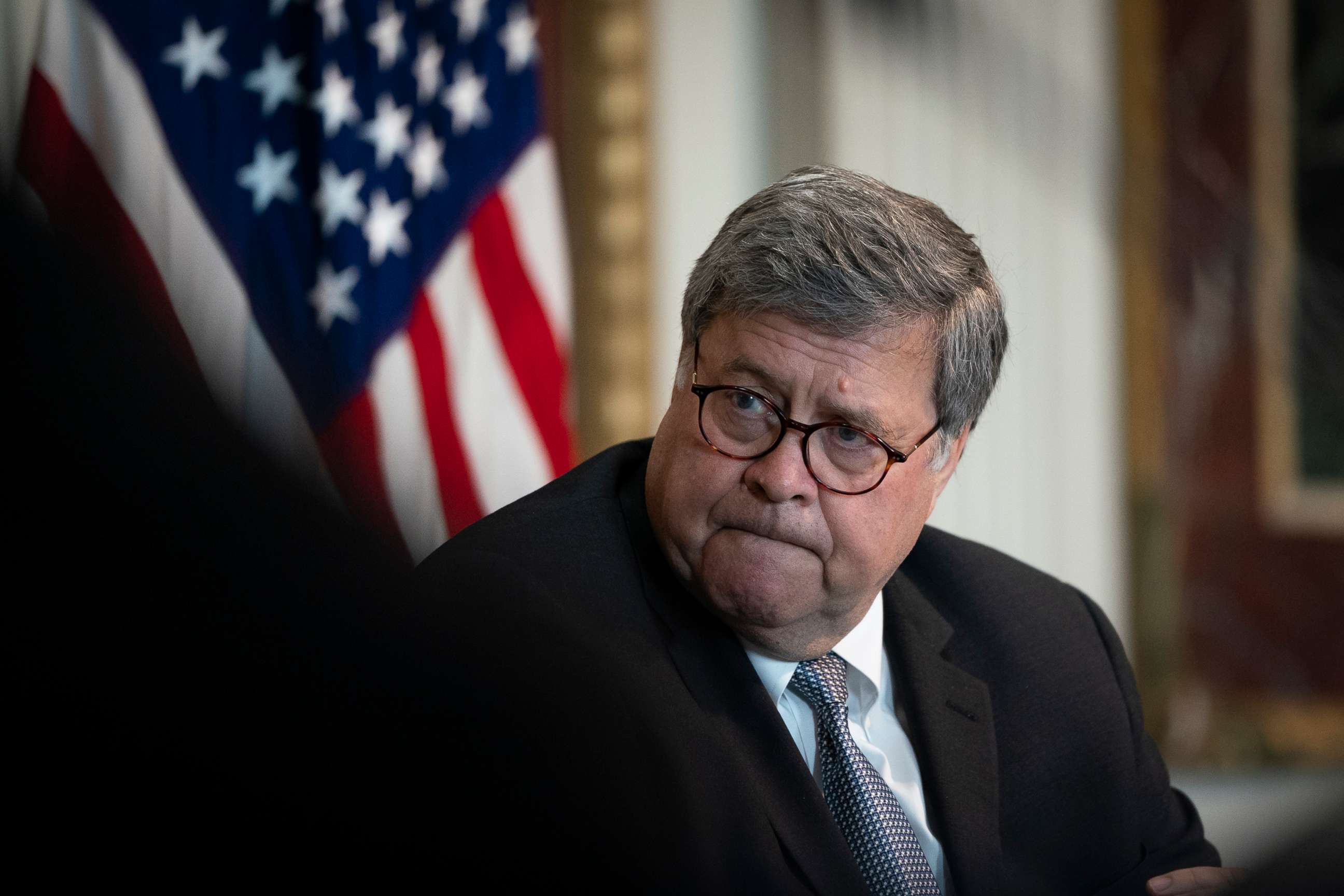 PHOTO: Attorney General William Barr listens during an event to highlight the Department of Justice grants to combat human trafficking, in the Indian Treaty Room of the Eisenhower Executive Office Building, Aug. 4, 2020, in Washington, D.C.