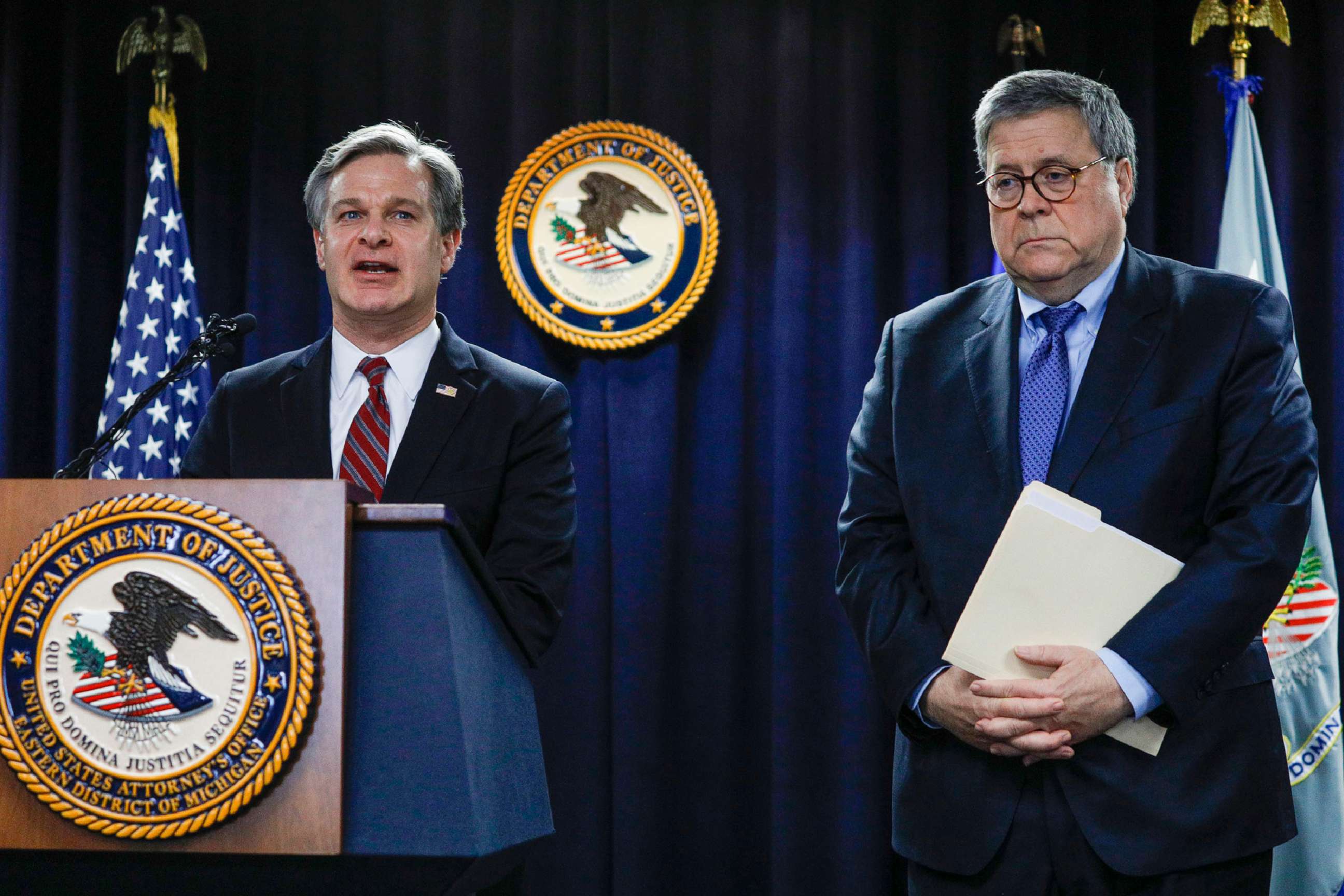 PHOTO: U.S. Attorney General William Barr, right, listens while FBI Director Christopher Wray, left, speaks at an announcement of a new Crime Reduction Initiative designed to reduce crime in Detroit, Dec. 18, 2019.