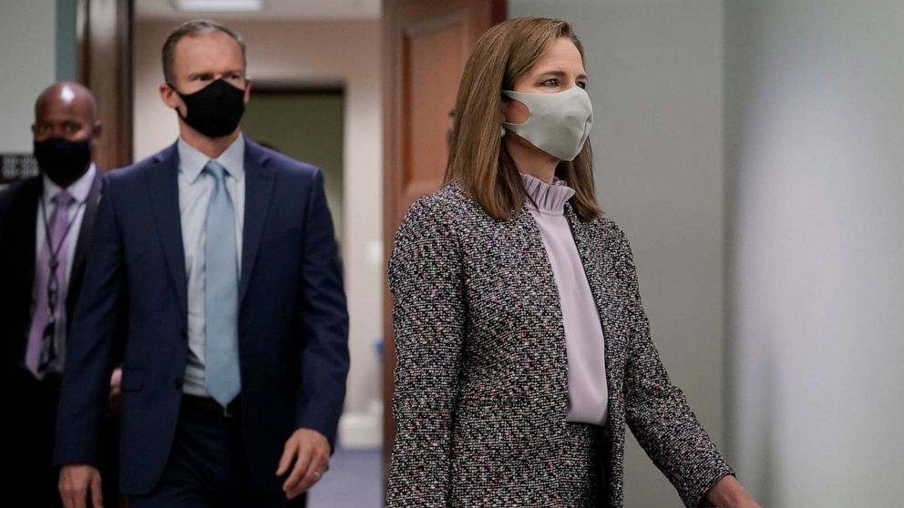 PHOTO: Supreme Court nominee Amy Coney Barrett arrives for the third day of her confirmation hearing with the Senate Judiciary Committee, on Capitol Hill in Washington, Oct. 14, 2020.
