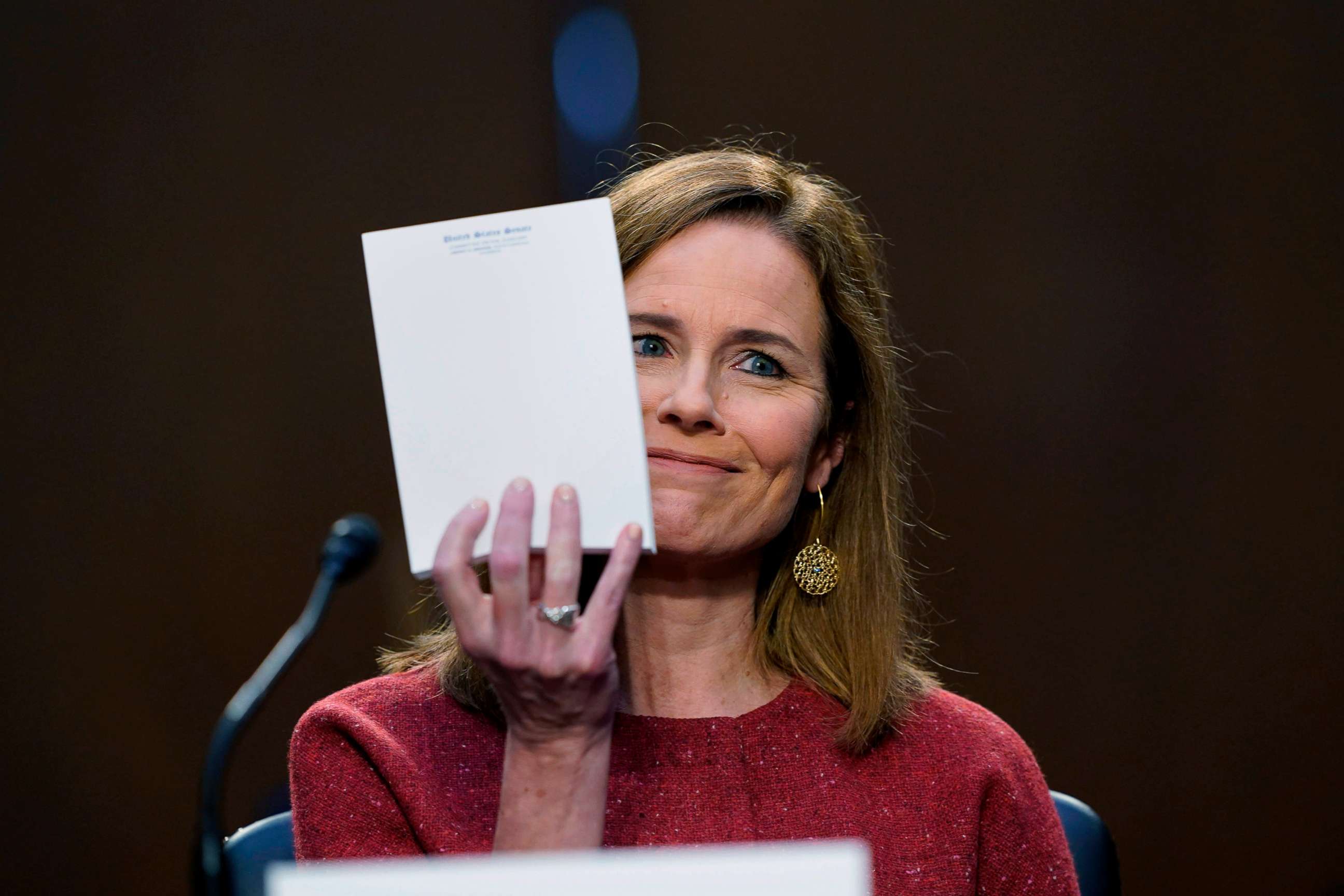 PHOTO: Supreme Court nominee Judge Amy Coney Barrett holds up pad of paper after being asked what material she was referring to during the second day of her confirmation hearing on Capitol Hill, Oct. 13, 2020, in Washington, D.C.