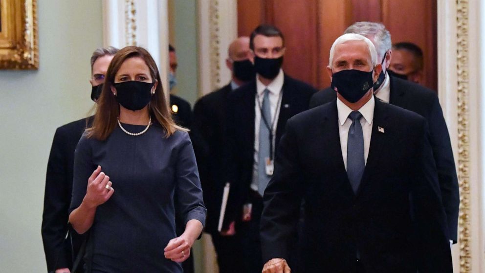 PHOTO: Supreme Court nominee Amy Coney Barrett and Vice President Mike Pence arrive at the Capitol to meet with senators in Washington, DC, on Sept. 29, 2020.