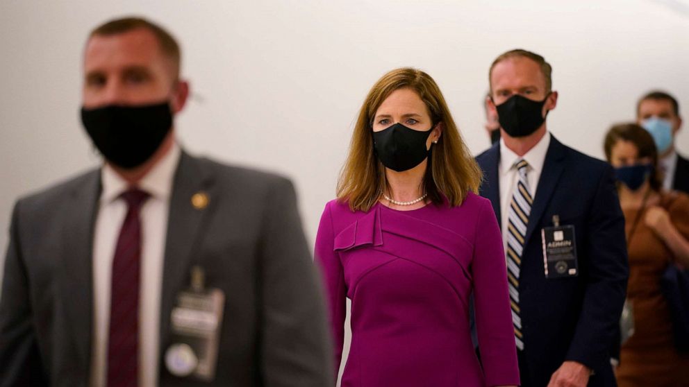 PHOTO: Supreme Court nominee Amy Coney Barrett walks back after a break on Capitol Hill to continue her Senate Judiciary Committee confirmation hearing before the Senate Judiciary Committee on Capitol Hill in Washington, Oct. 12, 2020.