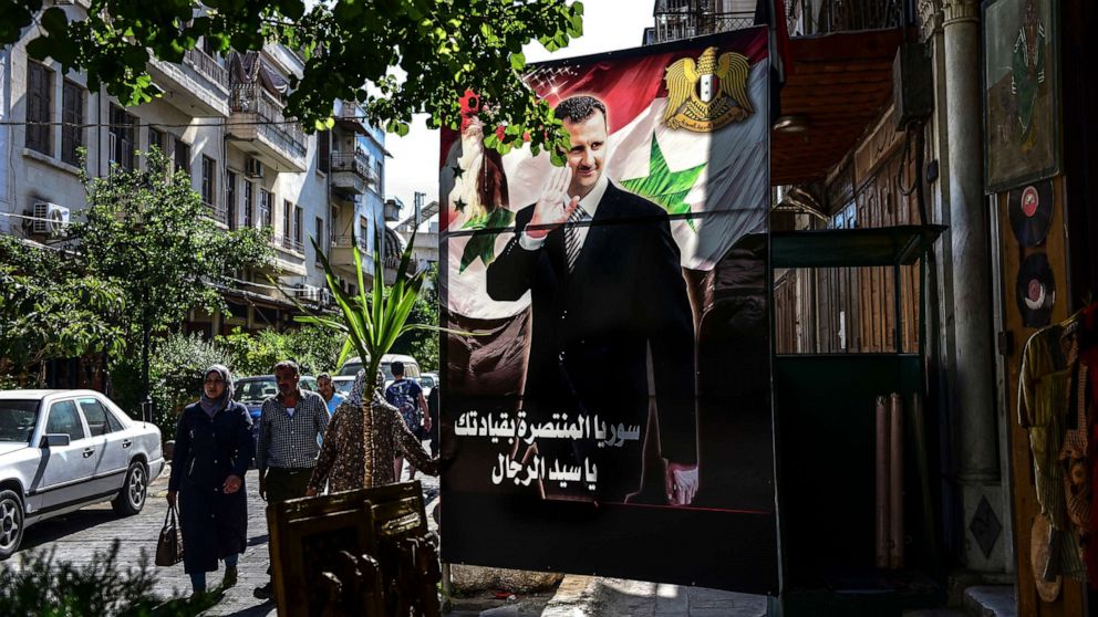 PHOTO: A banner of President Bashar Assad of Syria in Damascus, June 24, 2019.
